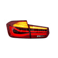 BMW 3 Series red and smoked black LED tail light assembly showing streamer design