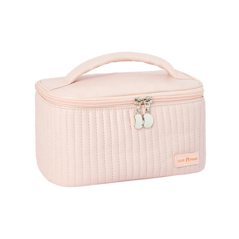 Open-top makeup bag in PU leather showing six colour options including pink, coffee, and light blue