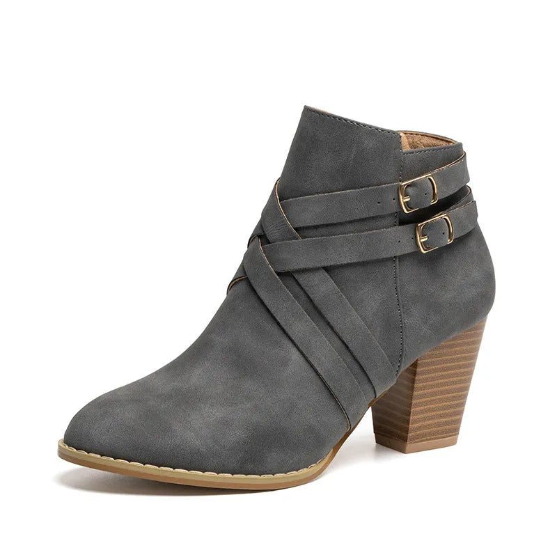 Plus size black short boots with a side zipper, buckle, and a 7cm stout heel on a rubber sole.