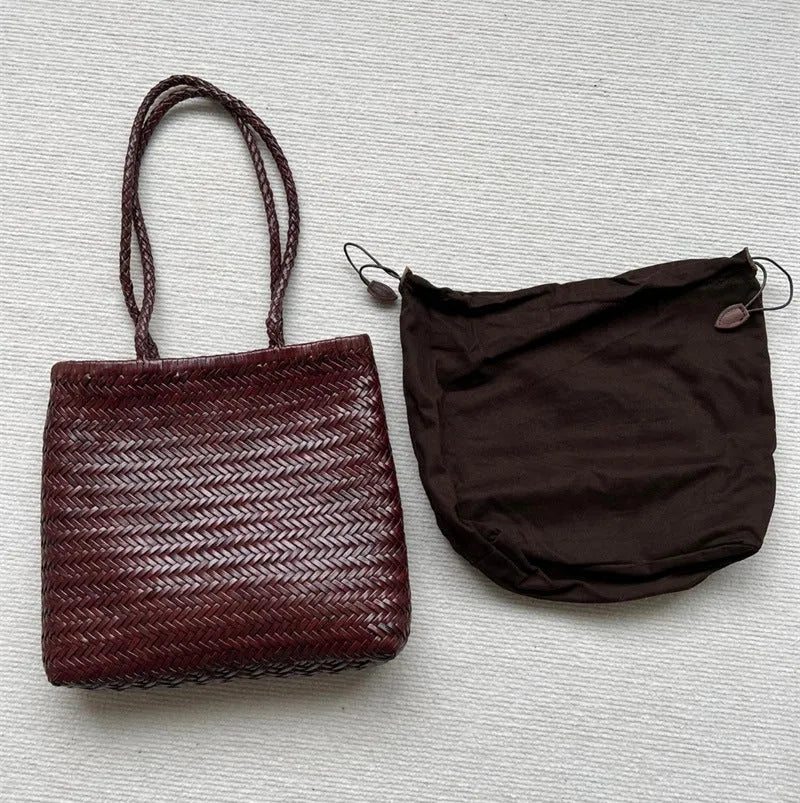 Brown handmade cowhide leather shoulder bag with woven tote design and three-dimensional pocket