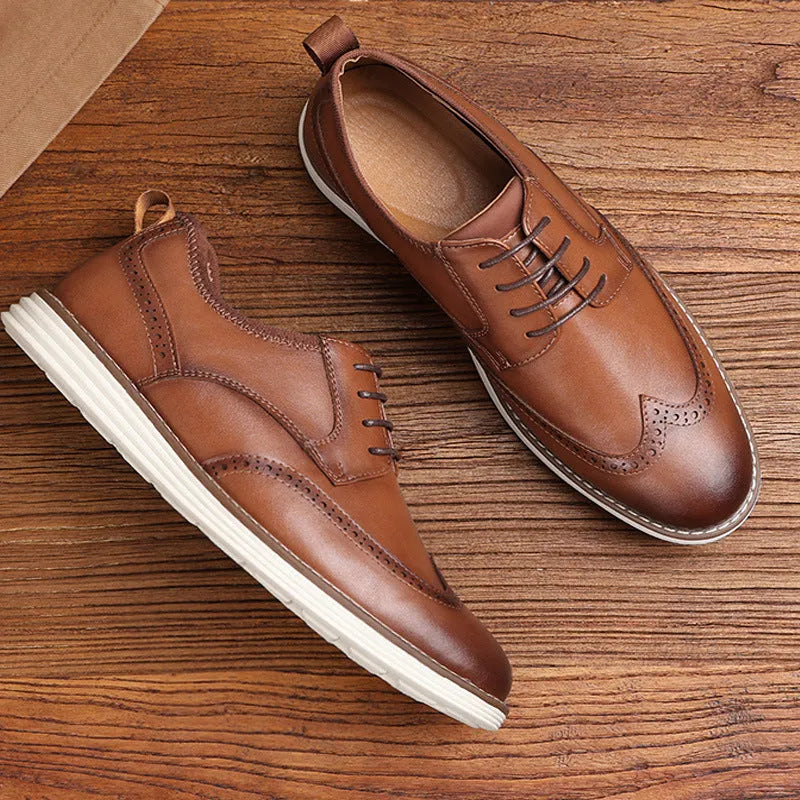 Men's black slip-on business casual shoes with decorative carved detailing and TPR soles