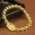 Yellow Pi Xiu bracelet with artificial crystal bead on leather cord, Chinese zodiac design
