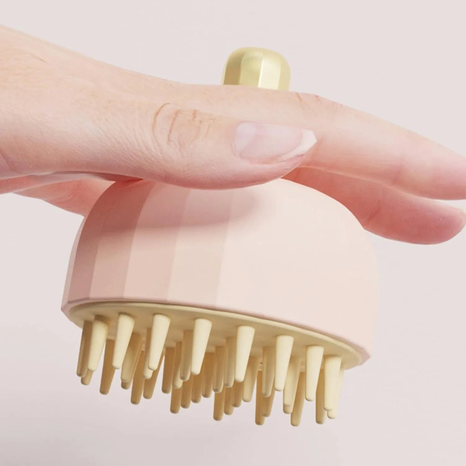 Green double-sided pet bath massage brush with silicone bristles and drain holes.