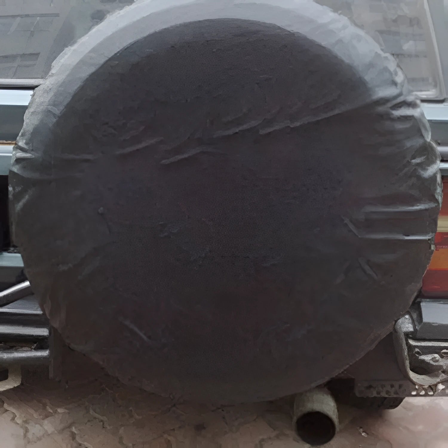 Pure black PVC faux leather spare tyre bag on a 16 inch car wheel