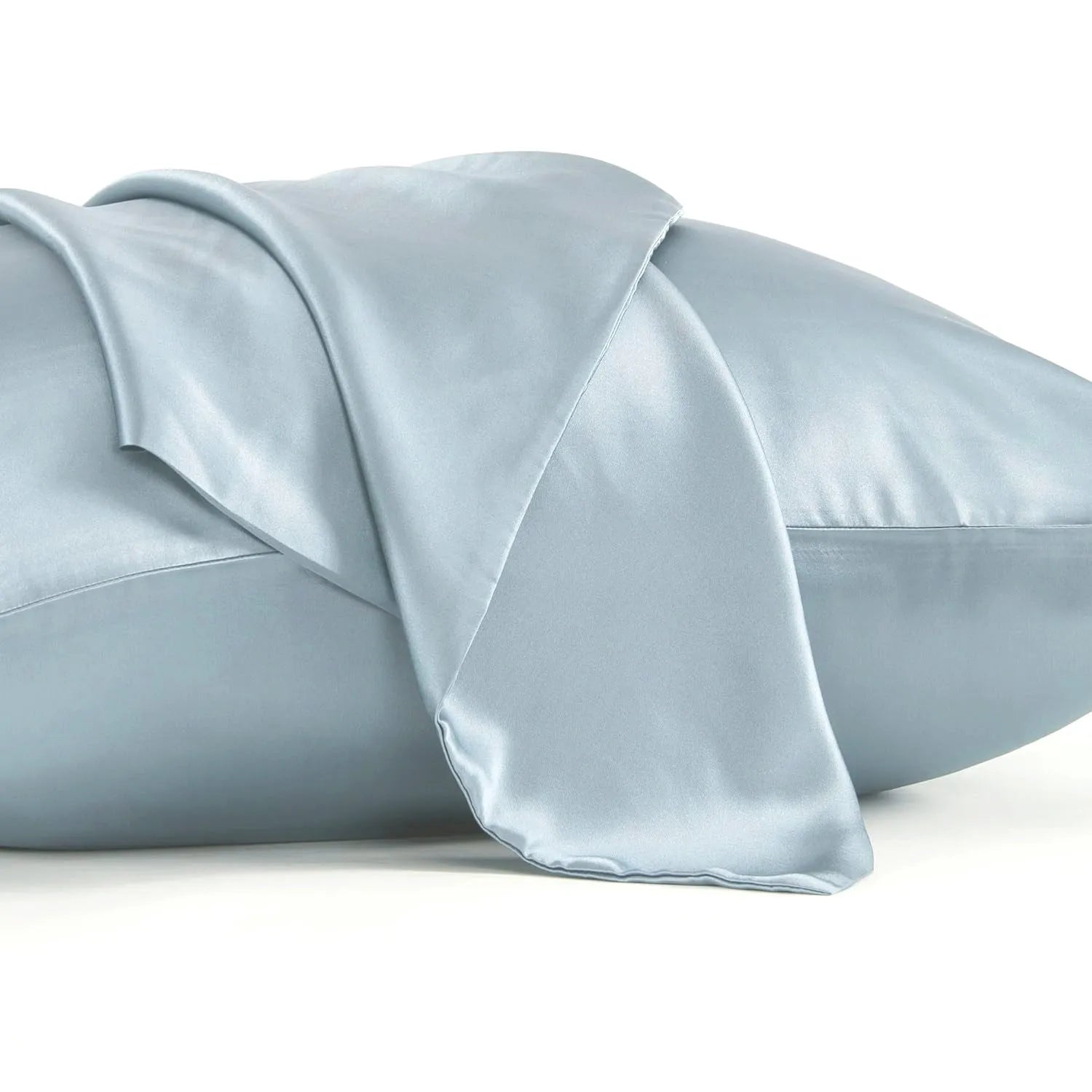 Dark grey mulberry silk pillowcase with an envelope closure on a bed.