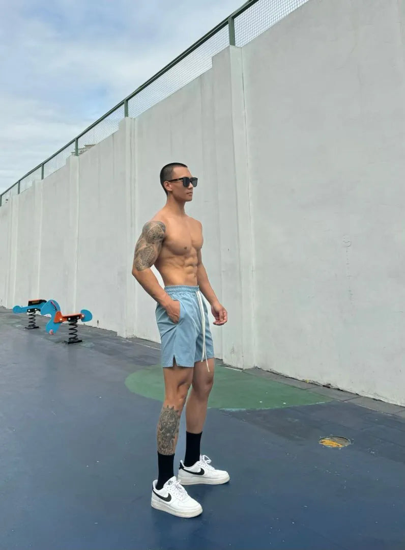 Men's quick-drying double-layer nylon shorts shown in multiple colours.