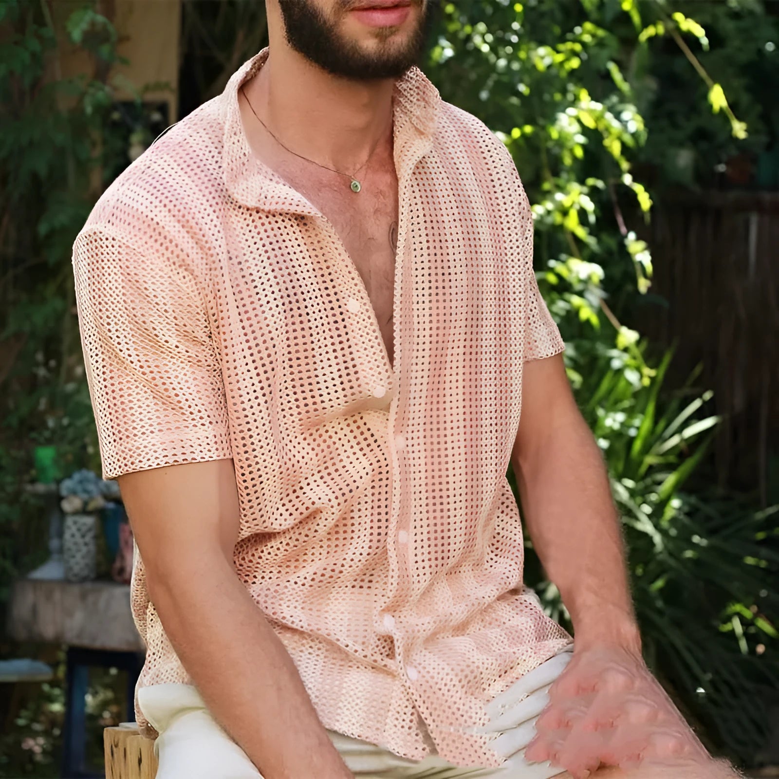 Pink men's loose-fit waffle texture short sleeve cardigan shirt on a hanger.