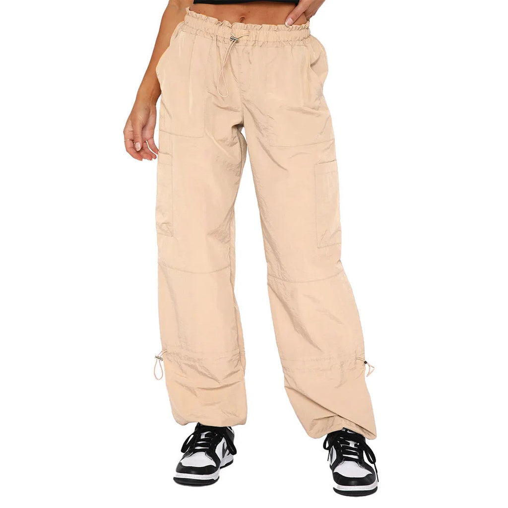 Straight-leg loose fit cargo casual pants in grey with multiple pockets, made from polyester fabric.