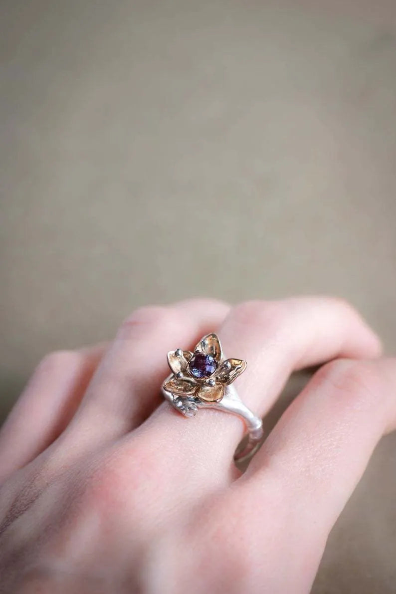 Silver two-tone women's ring with geometric shapes and floral design elements on alloy metal