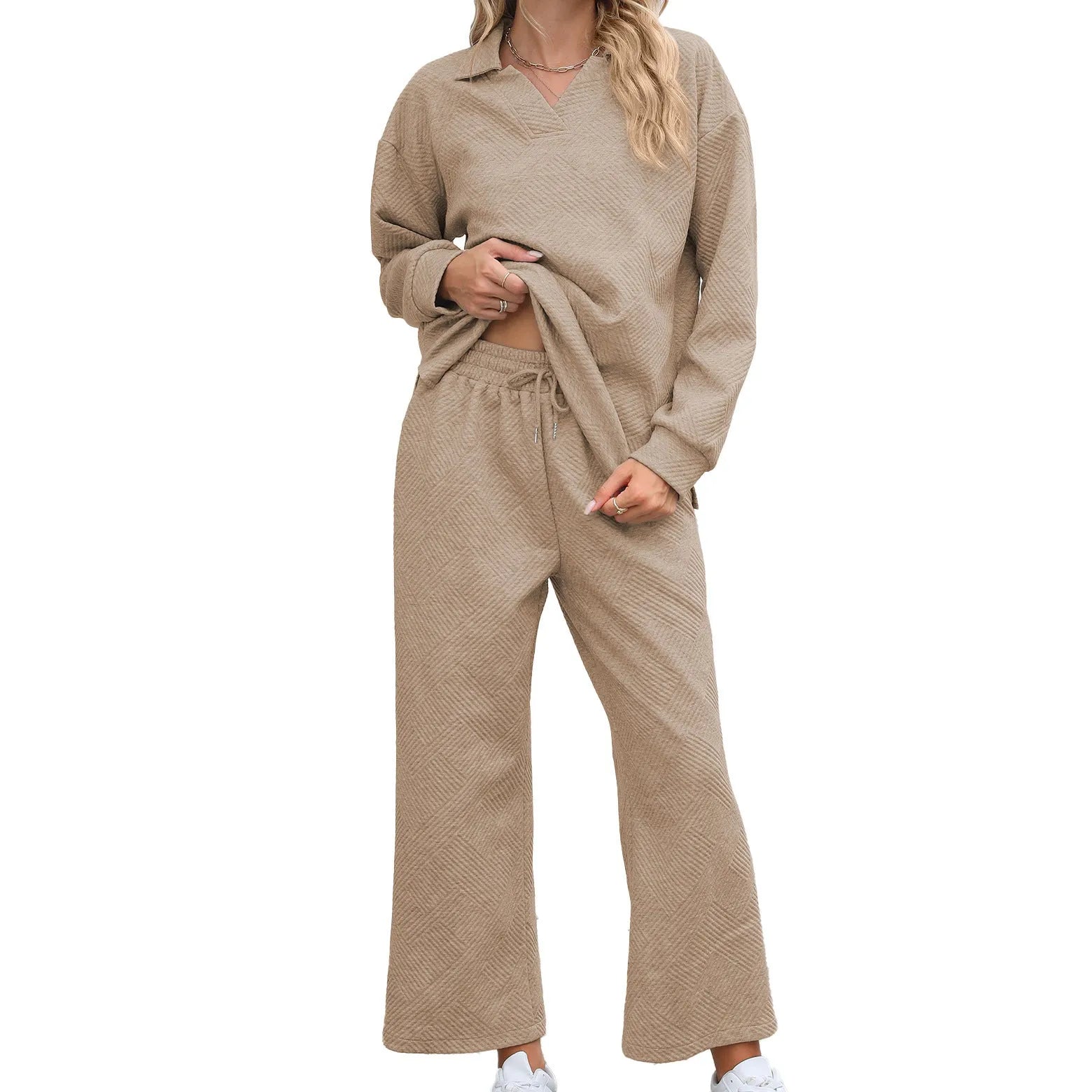 Women's geometric patterned knitted suit set with lapel sweater and cropped trousers in multiple colours.