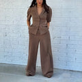 Brown polyester two-piece suit with trousers and matching top slim fit waist