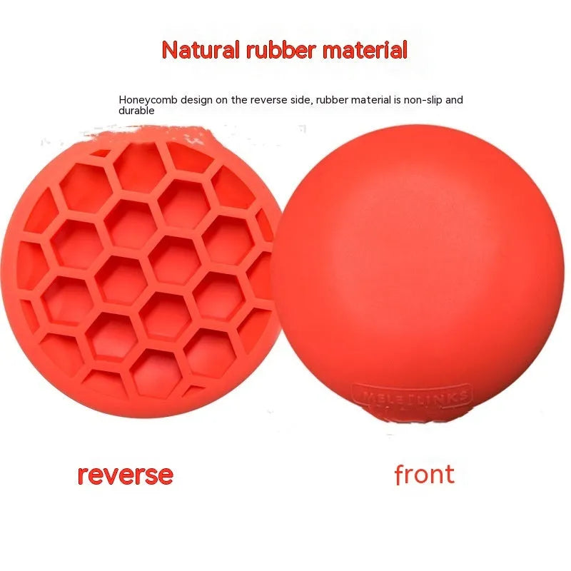 Orange natural rubber golf centre of gravity training mat on practice surface