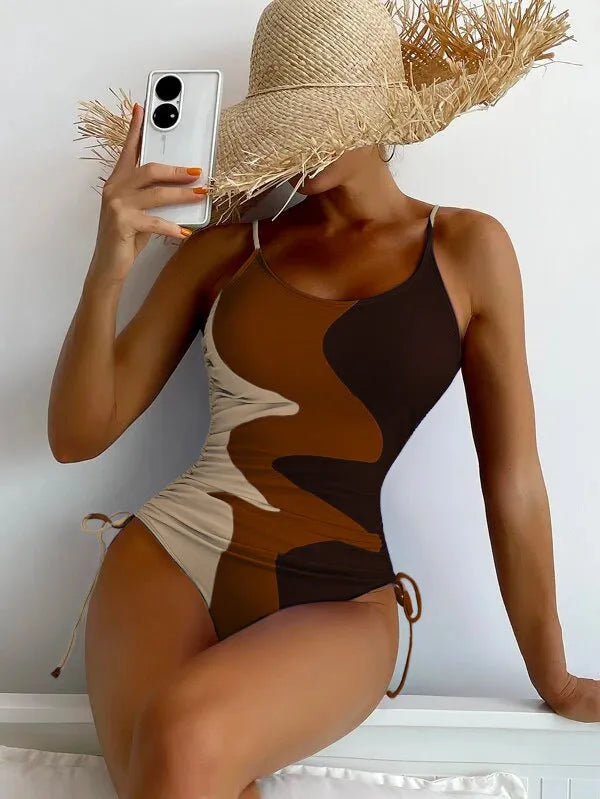 Women's sleeveless backless one-piece swimsuit in blue, shown in a solid colour style.