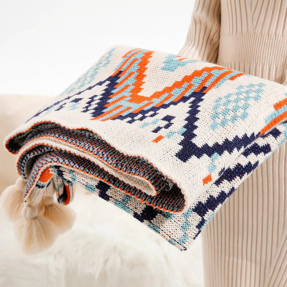 Bohemian-style acrylic sofa blanket with tassel edges in geometric pattern or solid colour options
