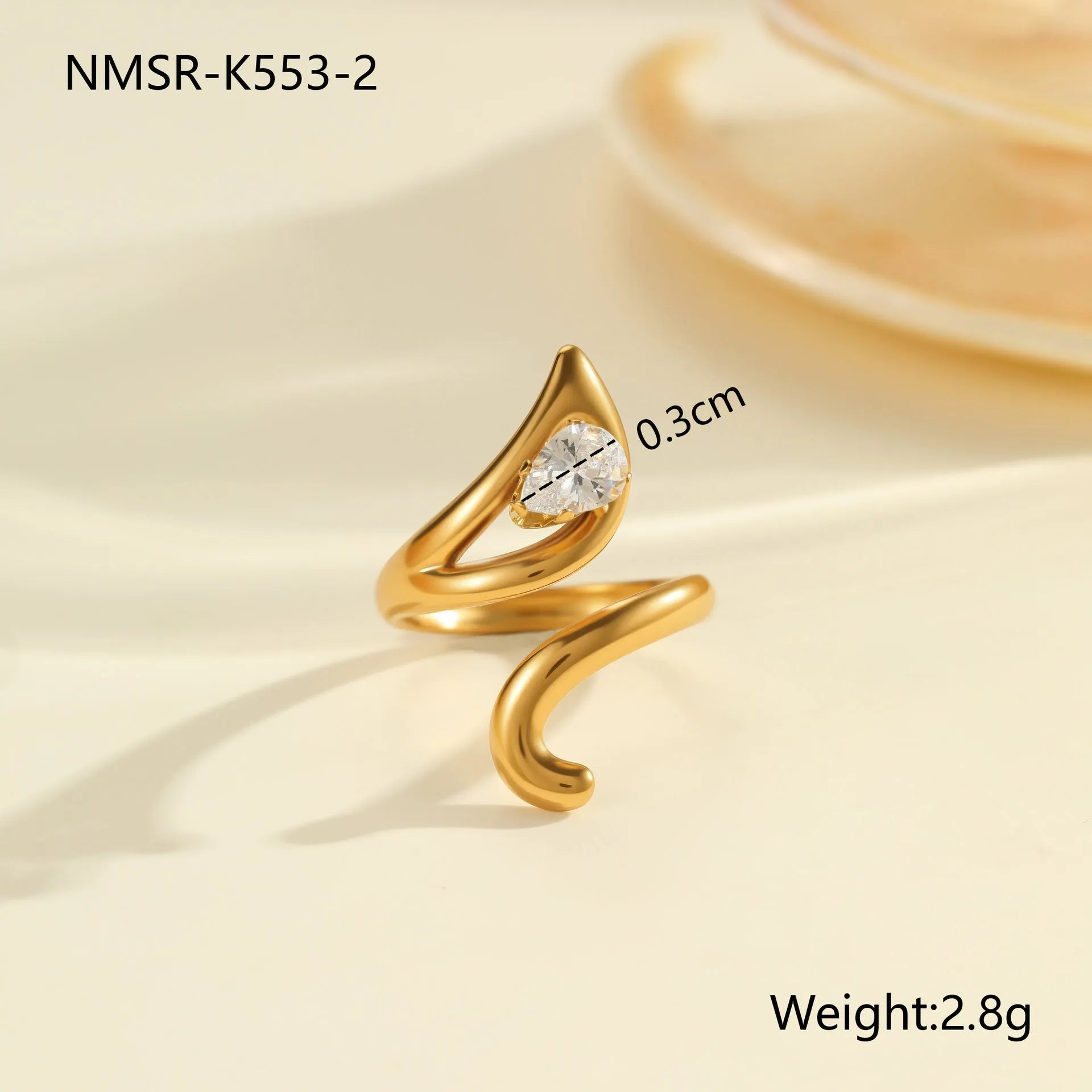 Women's geometric zircon ring with adjustable open mouth design on a hand.