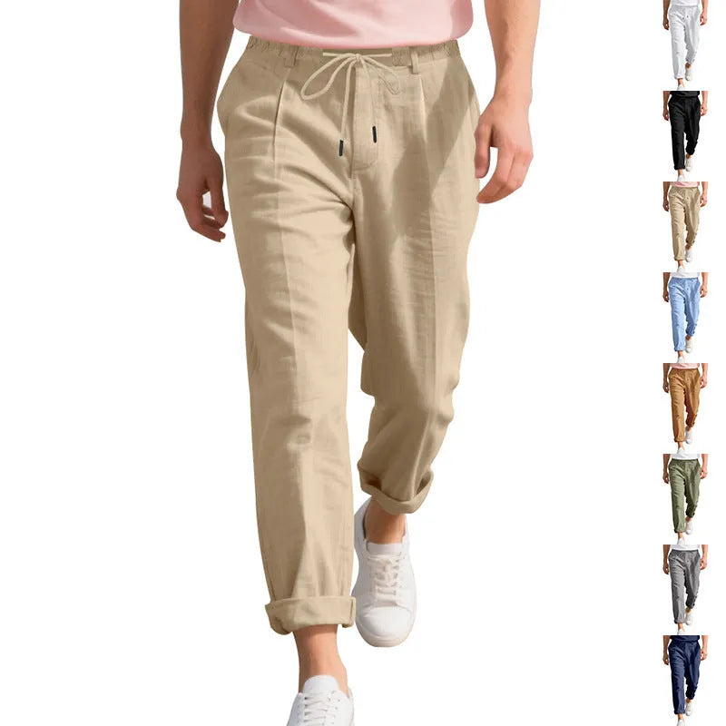 Men's loose-fit straight-leg linen trousers in light khaki colour with a drawstring waist.