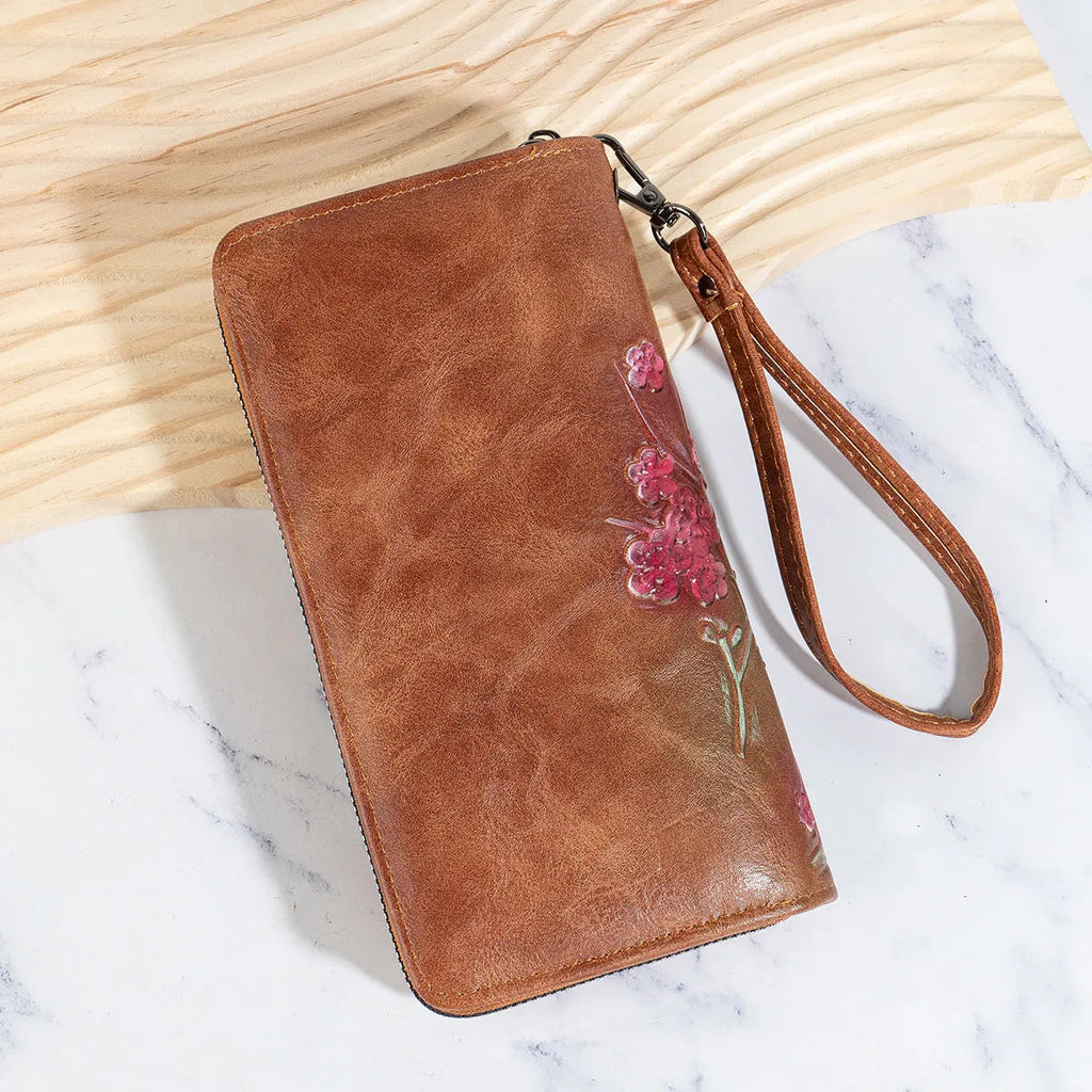 Embossed floral pattern Chinese style handbag in brown colour with zipper closure