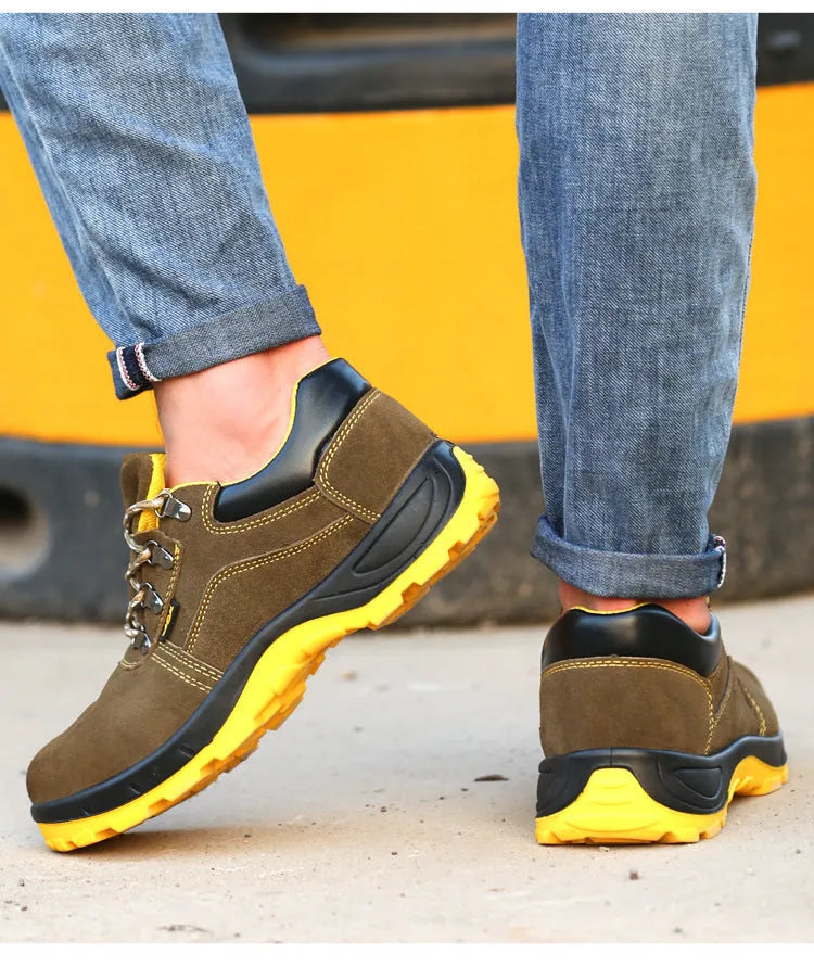 Bronze cow suede leather steel toe safety boots with non-slip sole on workplace surface