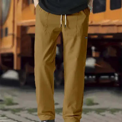 Men's polyester trousers in light grey, shown laid flat, suitable for spring and autumn wear.