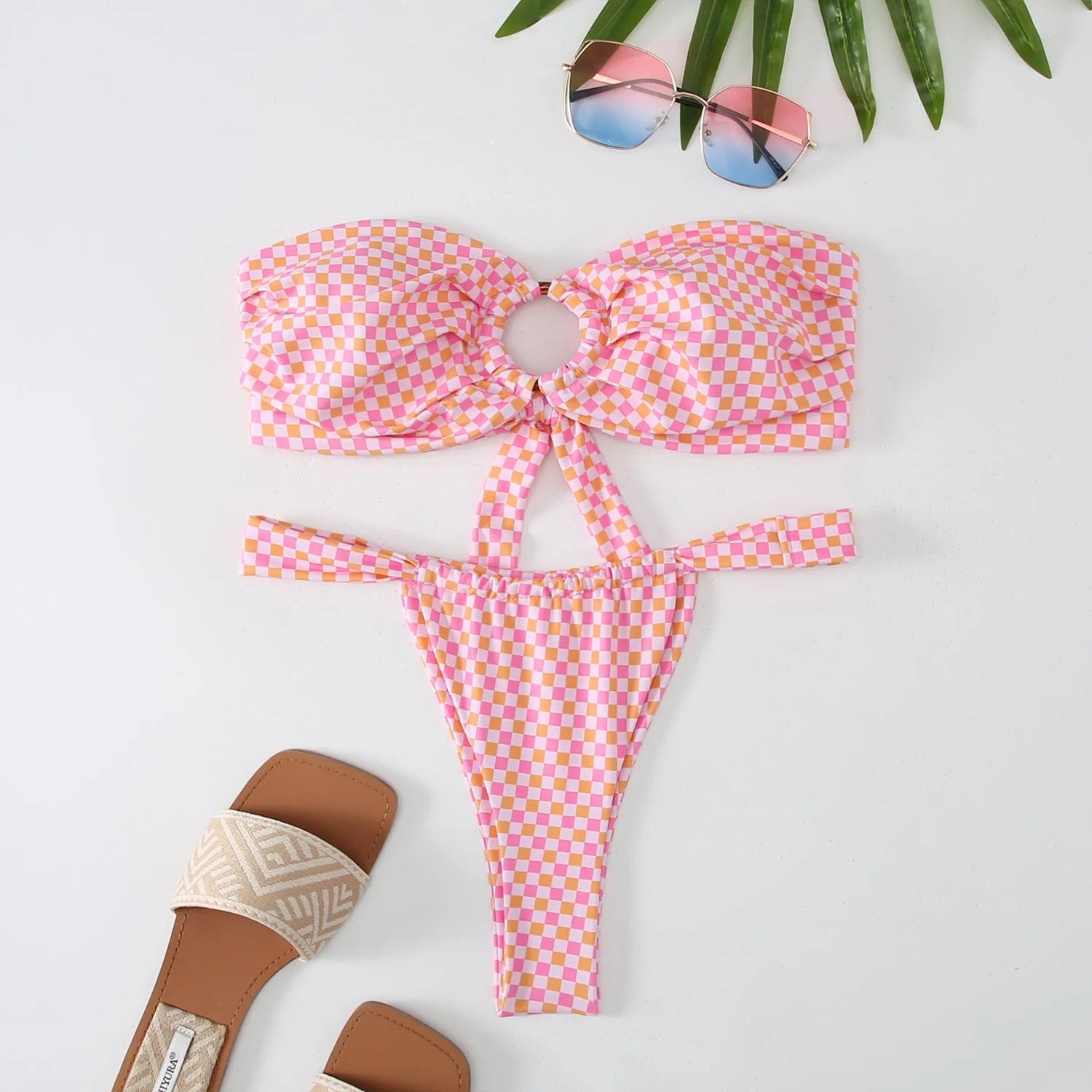 Women's floral print tube top ring bikini swimsuit set on mannequin