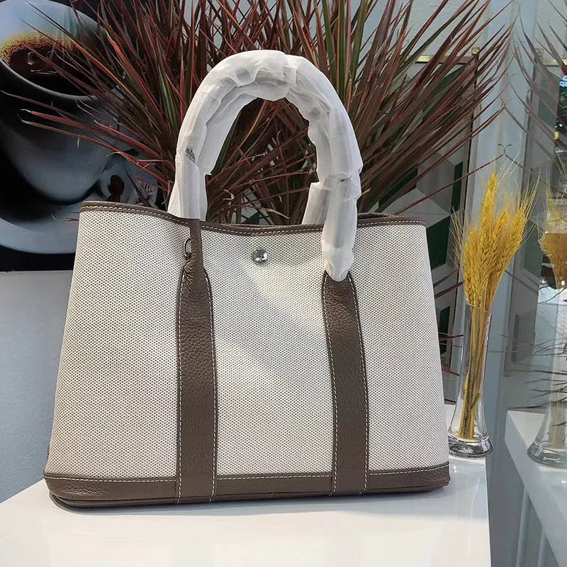 Genuine leather women's crossbody tote bag with canvas lining in bucket shape