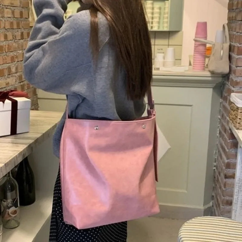 Corduroy one-shoulder commuter bag in pink or brown with PU lining, showing dimensions