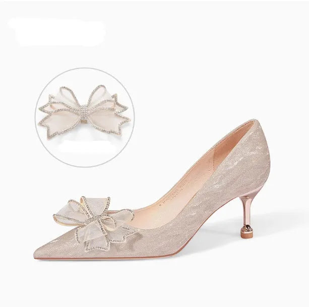 Women's champagne gold stiletto high heels covered in crystal sequins with a pointed toe.