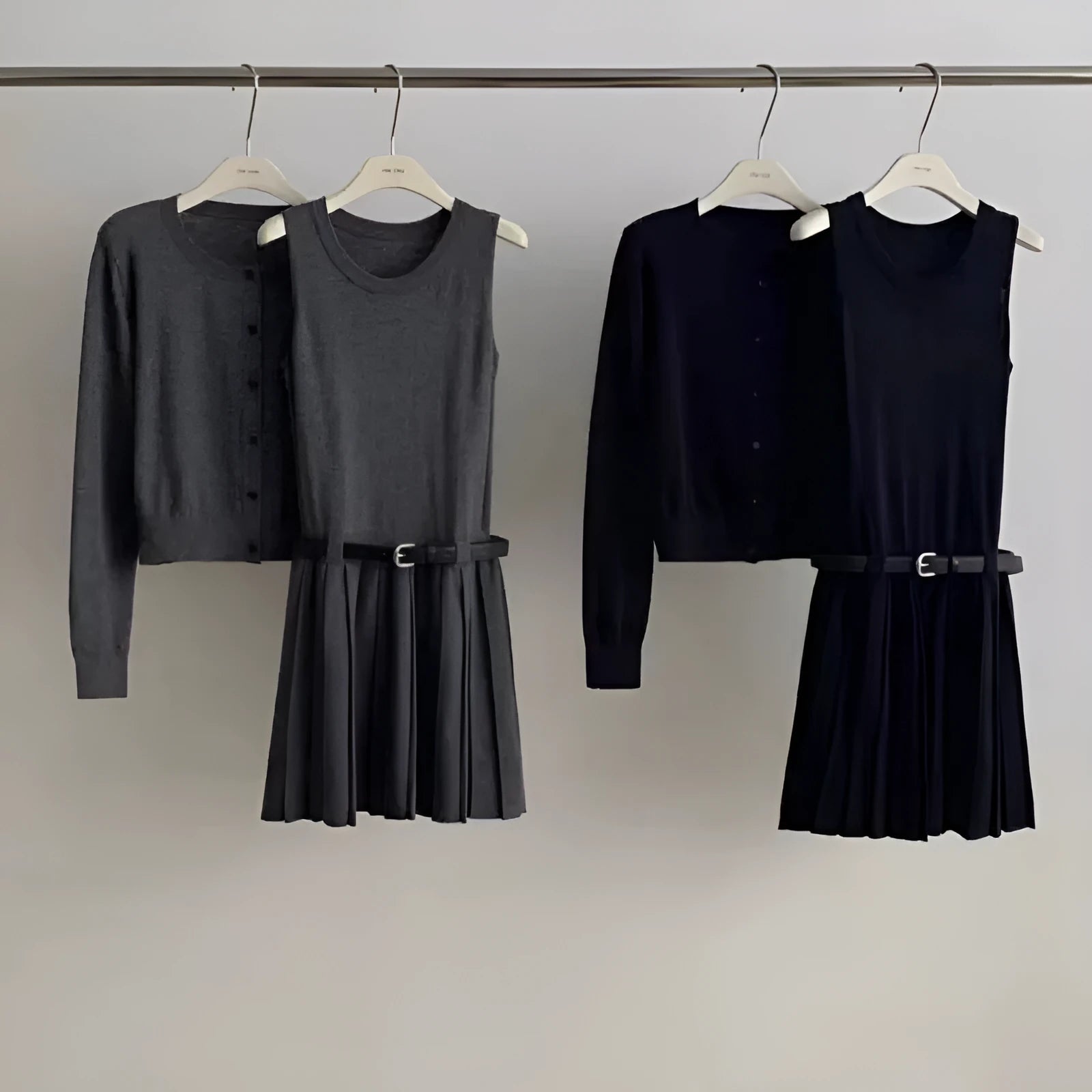 Women's grey national style knitted two-piece set with pleated vest skirt and long-sleeved cardigan.
