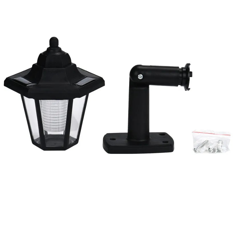 Black hexagonal solar-powered wall lamp with IP44 waterproof rating for outdoor garden lighting