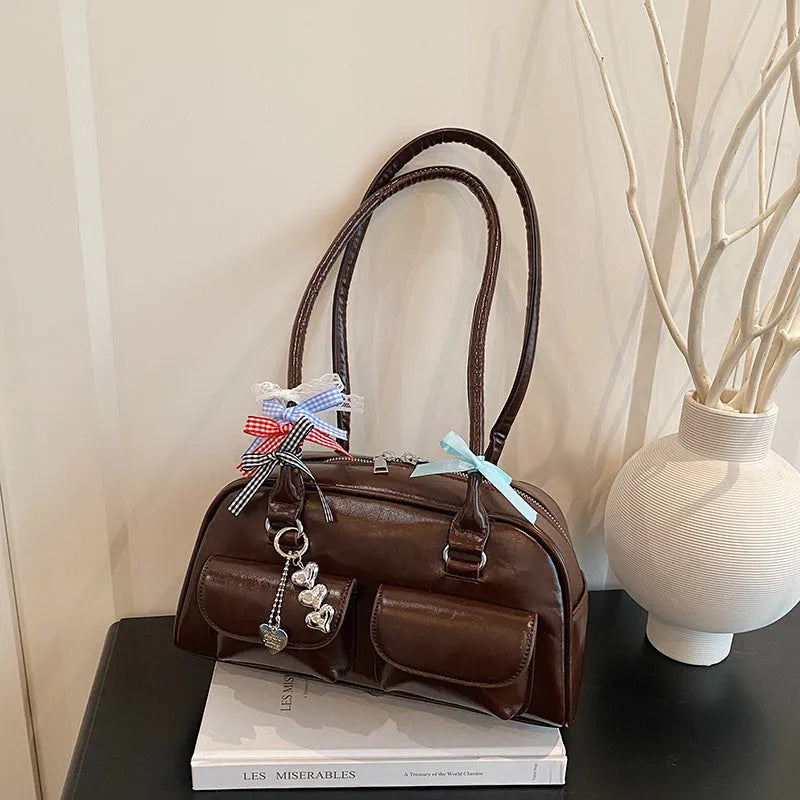 Retro women's pillow bag in PU leather with double shoulder straps and flap closure
