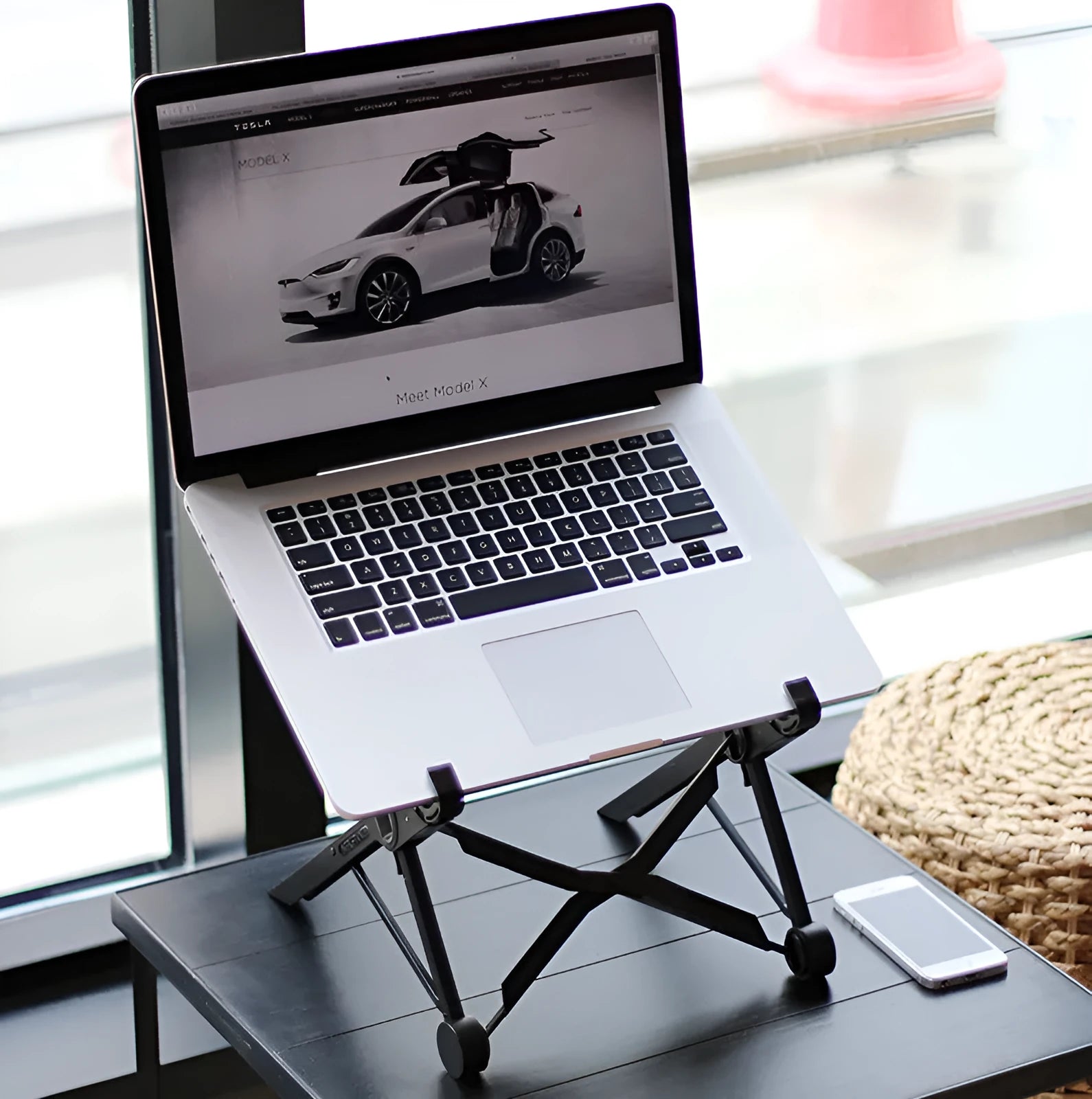 Black folding portable laptop stand showing reinforced nylon construction and compact 35.4cm design