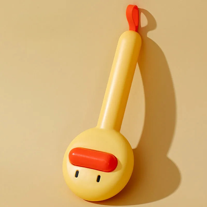 Small yellow duck-shaped pet grooming comb with needle pins for cats and small dogs