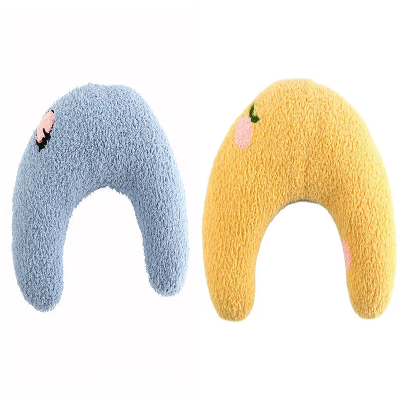 Small blue U-shaped plush pillow for cats or small dogs on a white background.