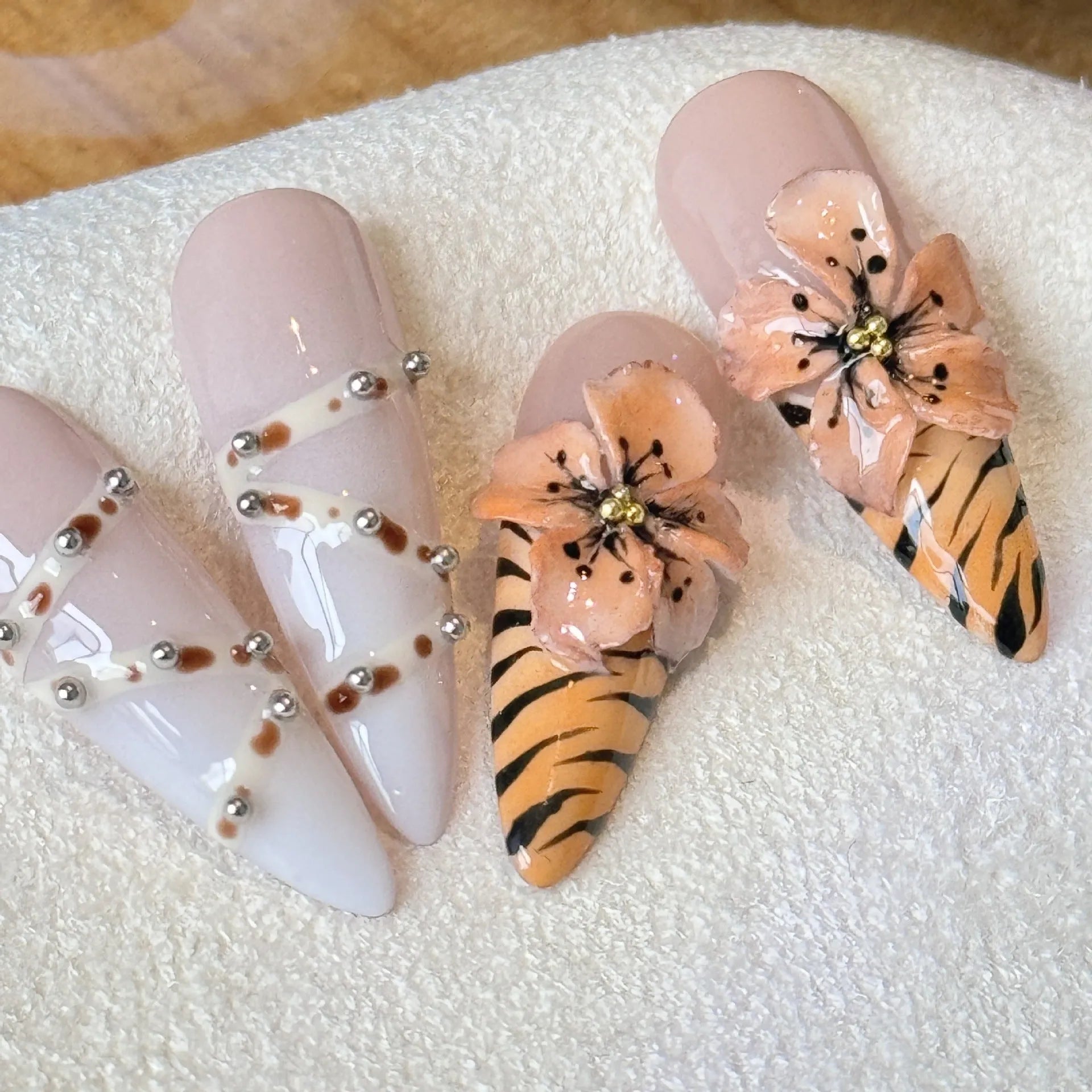 Handmade leopard print false nail stickers with cross and flower designs in sizes XS S M L