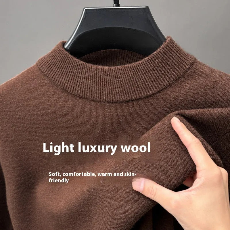 Men's solid colour fine yarn half-turtleneck long sleeve pullover on a hanger.