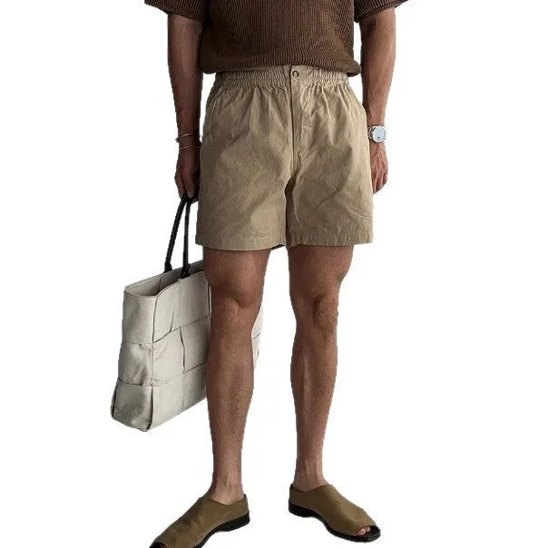 Cotton sports shorts in loose fitting design available in black, white and khaki colours