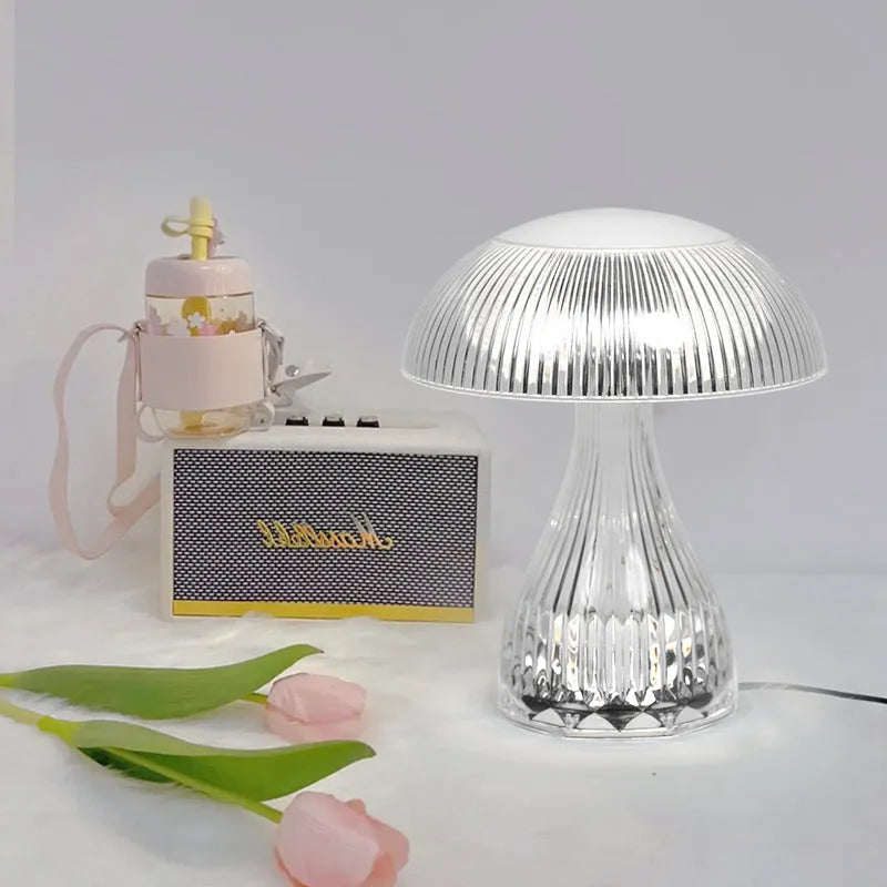 White rechargeable three-colour changing LED table lamp with acrylic light body.