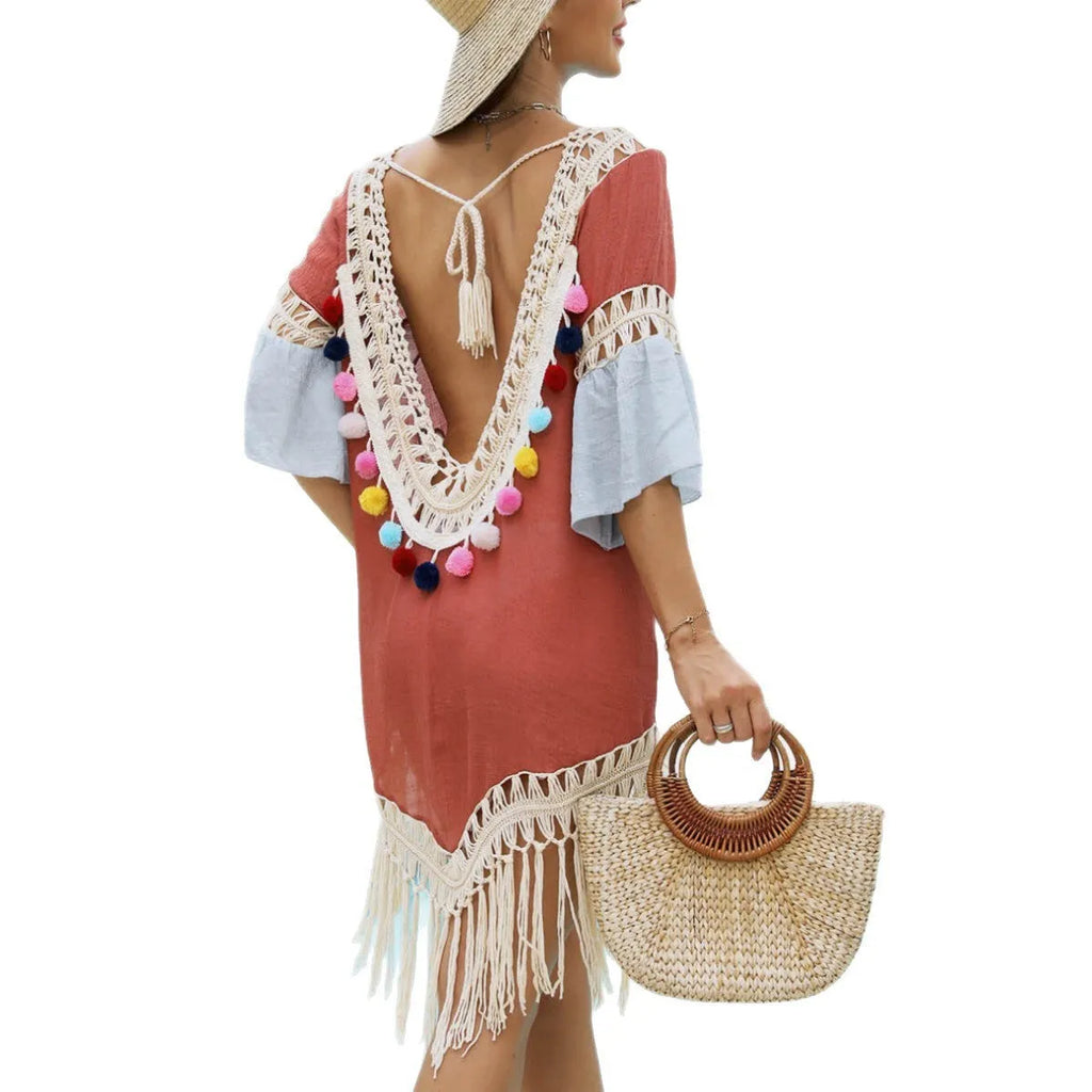Orange floral pattern beach overskirt blouse with crochet stitching and tassel trim.