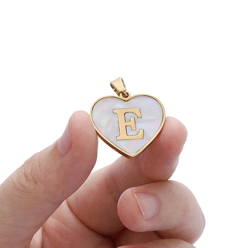 Gold plated heart-shaped personalised necklace with white shell charm on an adjustable chain.