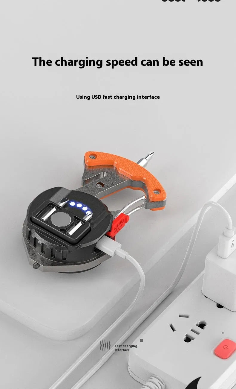 Compact silver and black multifunctional keychain flashlight with keyring, display screen, and integrated window breaker tool.