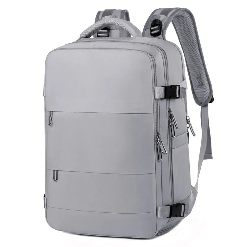 Large purple travel backpack with multiple compartments, shown with a laptop and organised interior.