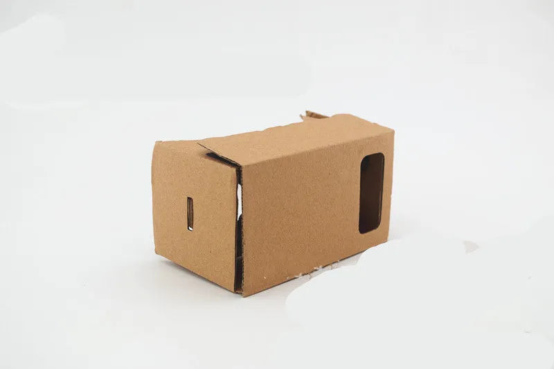 Pink and white cardboard VR glasses for smartphones with head strap and 3D lenses.