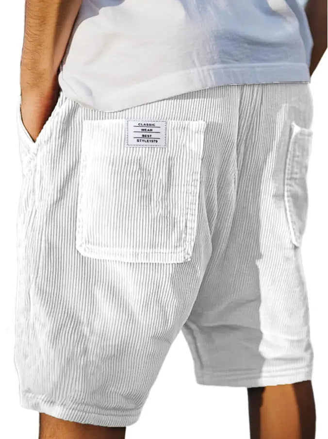 Men's grey corduroy shorts with multiple pockets and embroidery detail on leg, laid flat.