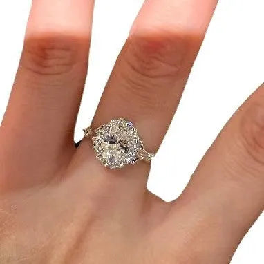 Silver geometric bridal bouquet ring with adjustable opening on index finger