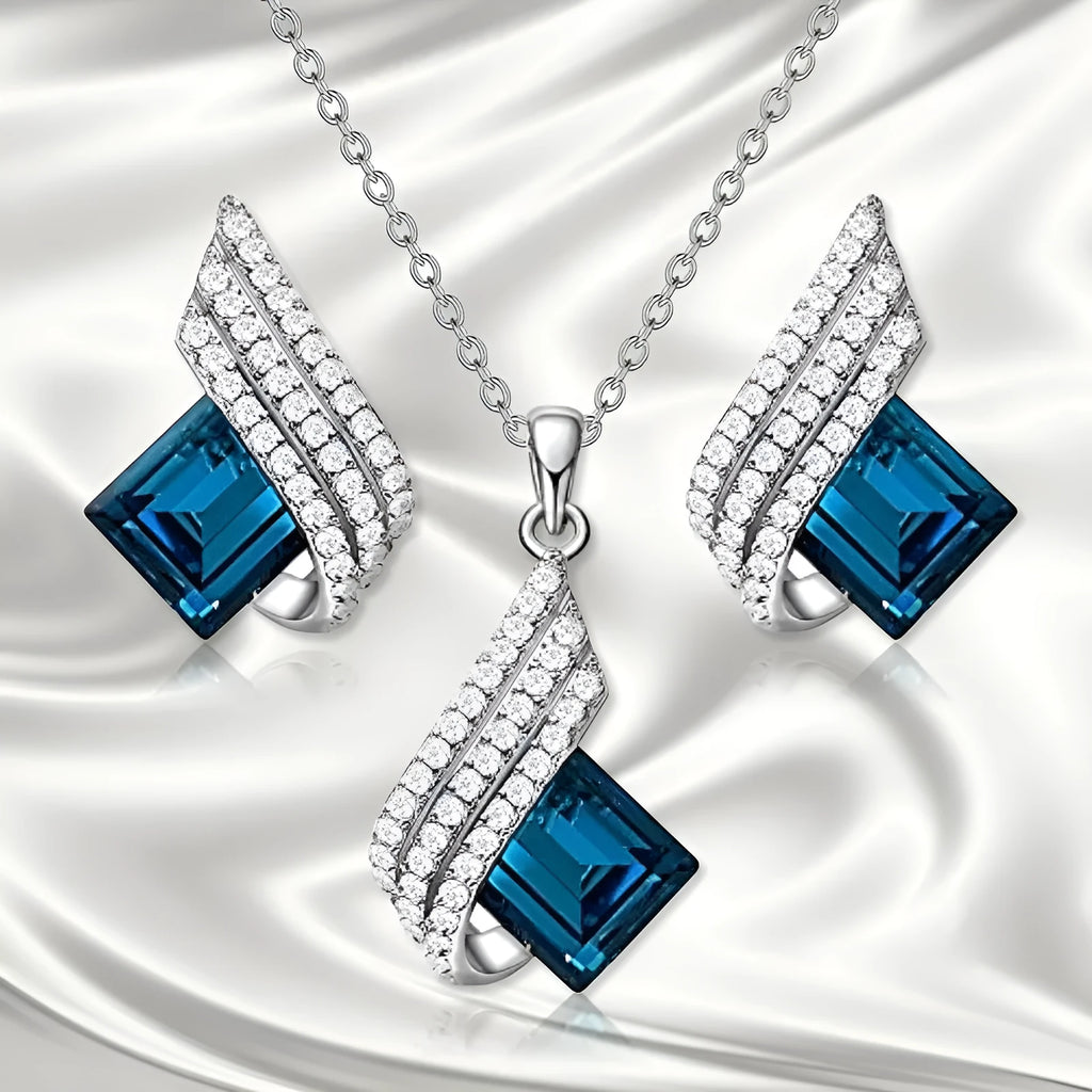 Gold-toned women's necklace and earring set with alloy, glass, and a cross chain, shown in two style options.