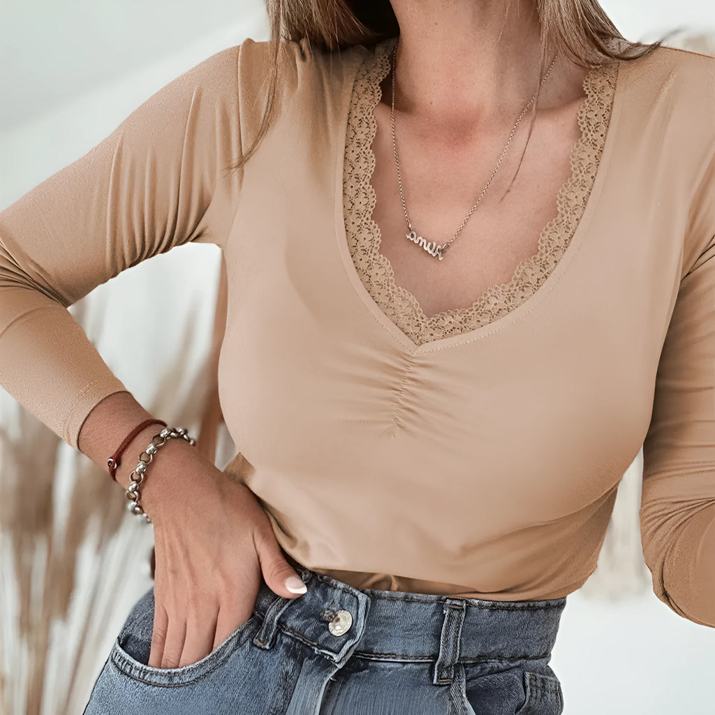 Women's red slim fit long sleeve casual top with delicate lace trim detail on the sleeves.