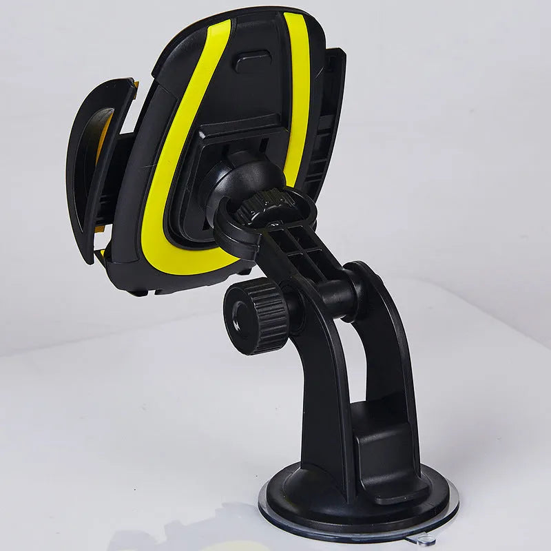 Red U-shaped suction cup car phone holder with automatic locking clamp arms on a dashboard.