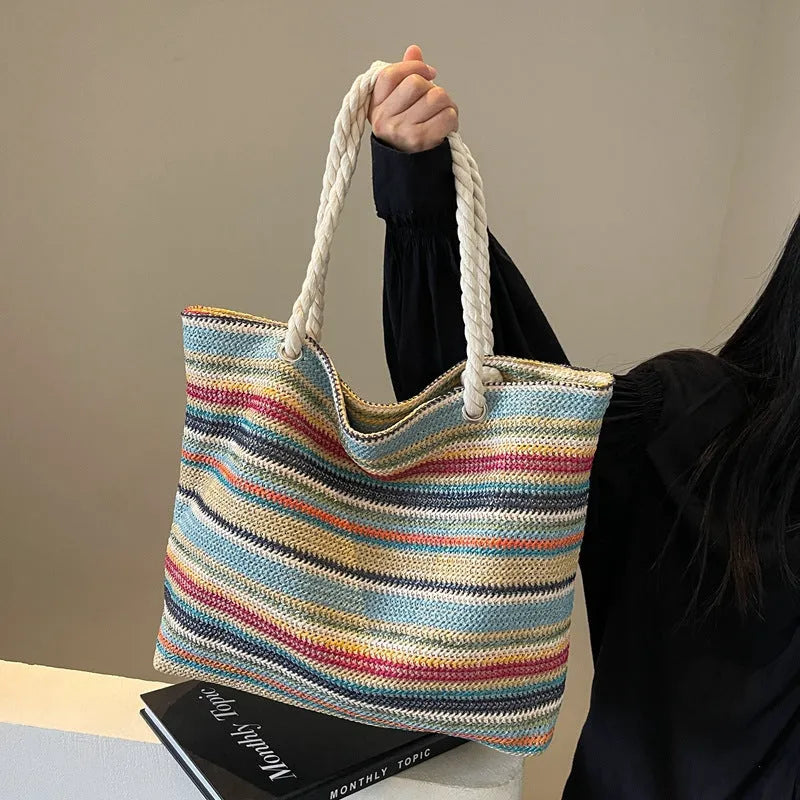 Blue straw woven nylon shoulder bag with single strap and woven texture pattern