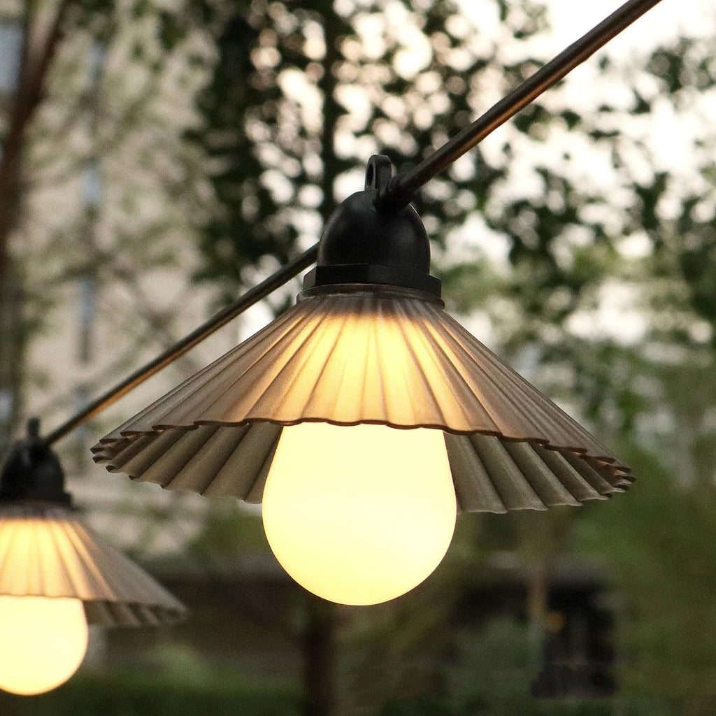 Outdoor LED string lights with flower-shaped bulbs in warm white and coloured options for garden and camping