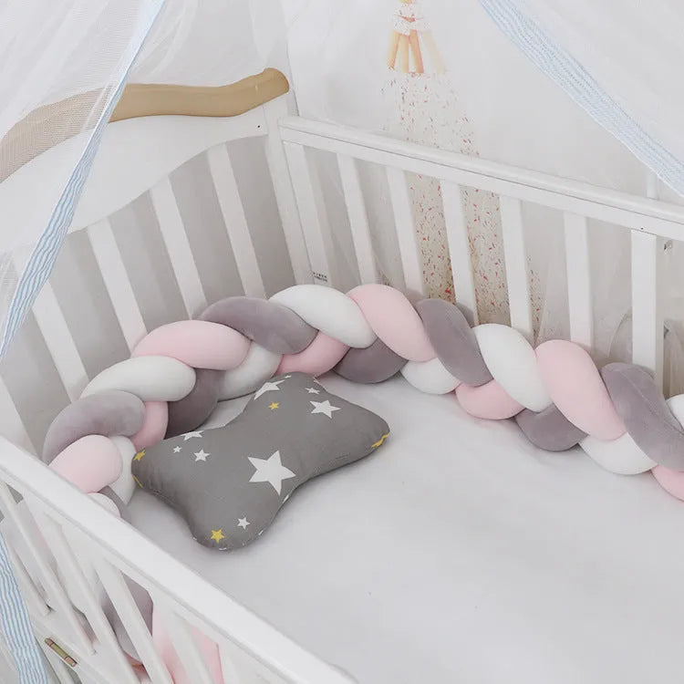 Soft spandex velvet baby crib bumper protector shown in a light grey colour, shaped around white crib bars.